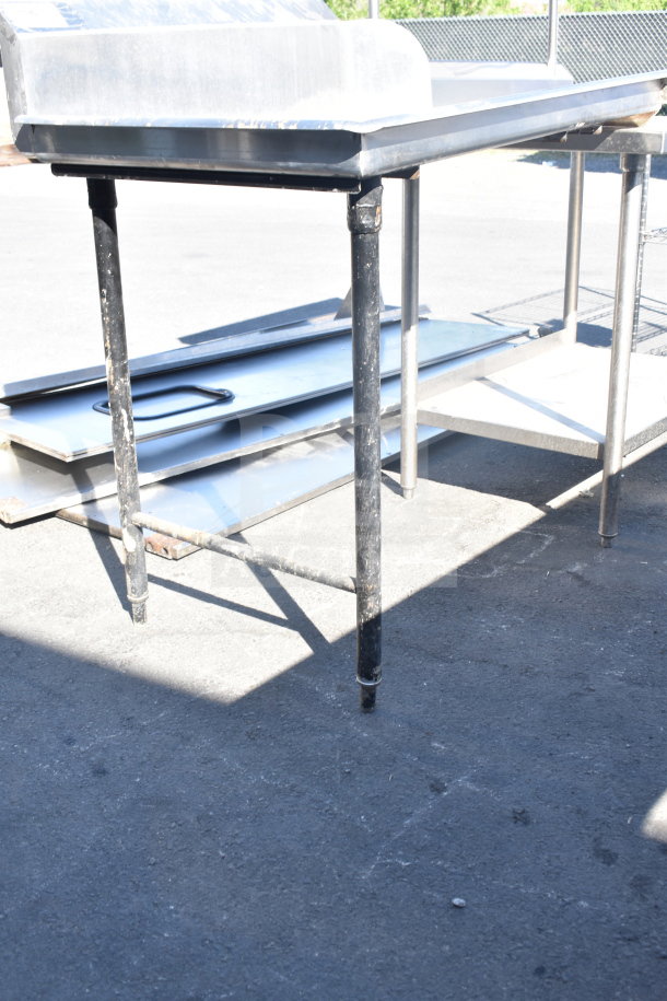 Commercial left side clean dishwasher table with stainless steel finish, sturdy legs, and lower shelf. Used condition.