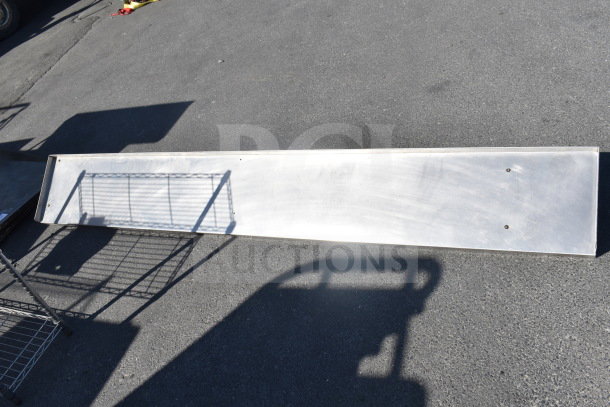 Stainless steel shelf, long rectangular shape, clean surface, four mounting holes visible, suitable for storage or display.