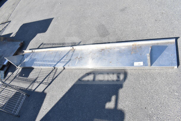 Stainless steel shelf with mounting brackets, light surface rust, tag number 666. Suitable for industrial use.