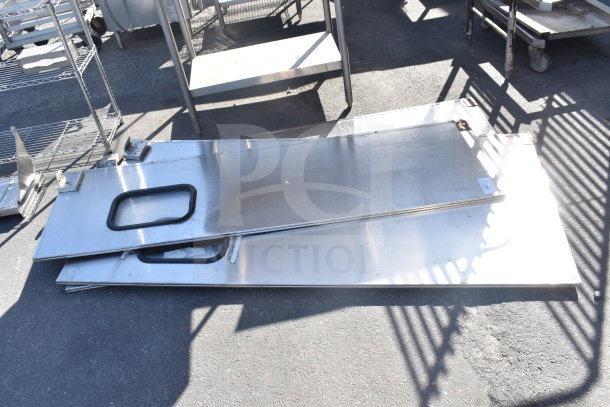 Three stainless steel swinging kitchen/traffic doors with handles, visible wear, auction item "3 Times Your Bid".