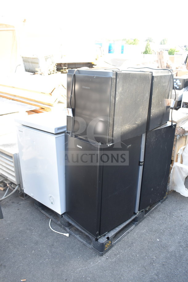 Seven mini coolers/freezers, brands include Galanz and Hisense, on display. 120 volts, 1 phase. Slight wear visible.