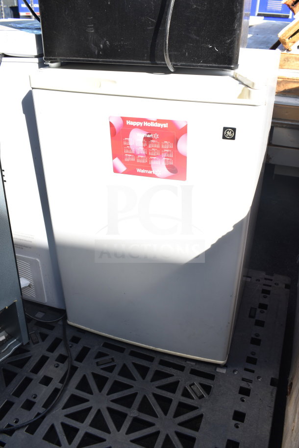 7 mini coolers/freezers, brands include Galanz and Hisense, 120 volts, 1 phase. Features visible GE branding.