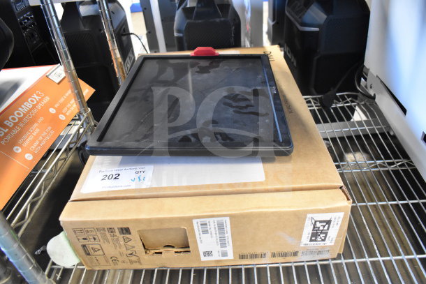 Two Dell computer monitors, SE2425HMf and E1715S, on a shelf. Includes original packaging. Condition appears used.