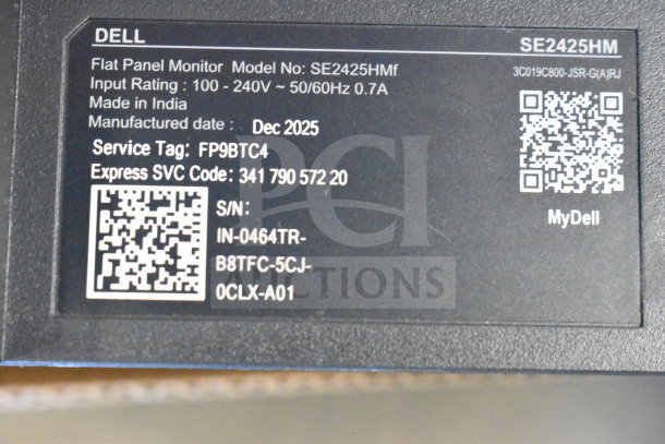 Dell SE2425HMf label with specs: 100-240V, 50/60Hz, 0.7A. Manufacture date Dec 2025. Service Tag: FP9BTC4. Made in India.