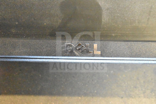 Two Dell monitors, models SE2425HMf and E1715S, in used condition, featuring Dell logo prominently.