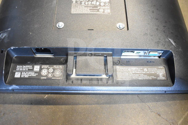 Two Dell computer monitors, models SE2425HMf and E1715S, showing labels with model and service tags on the back.