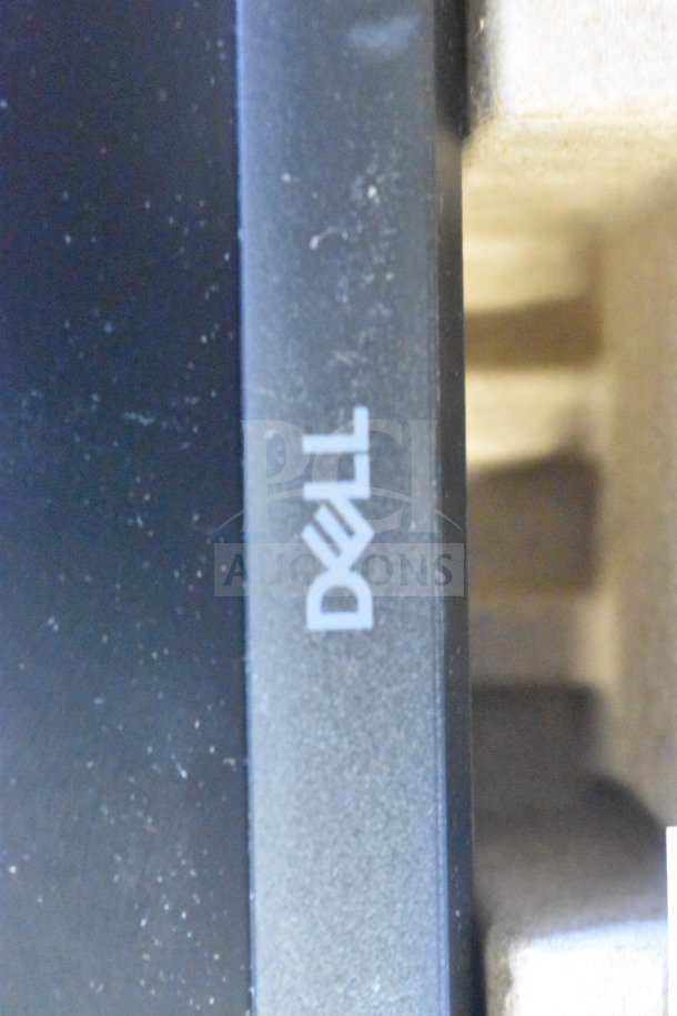 Dell computer monitors, models SE2425HMf and E1715S. Visible Dell logo on black frame.