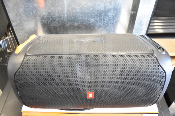 2 JBL PartyBox portable Bluetooth speakers, black, compact design, visible JBL logo, in good condition.