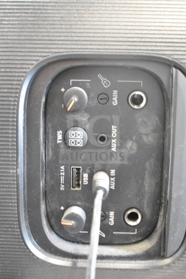 Two JBL PartyBox portable Bluetooth speakers showing control panel with volume, USB, AUX, and gain inputs.