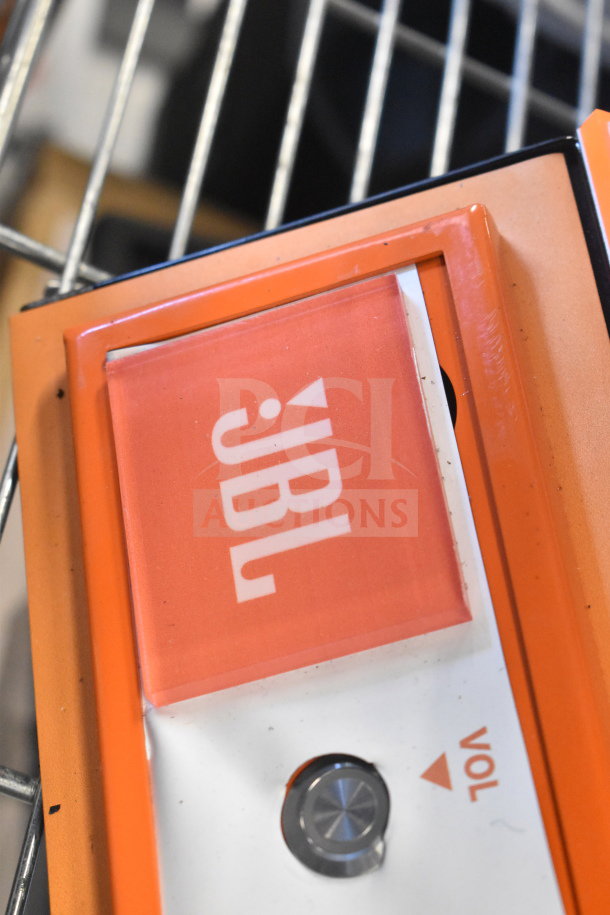 2 JBL PartyBox speakers, orange accent, portable Bluetooth, volume knob visible, ideal for events, excellent condition.