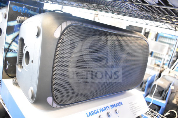 2 Onn Portable Bluetooth Speakers, large grille, sturdy design, box labeled "Large Party Speaker," ideal for events.