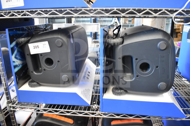 Two Onn portable Bluetooth speakers on display shelves, in good condition, showing control panels and packaging labels.