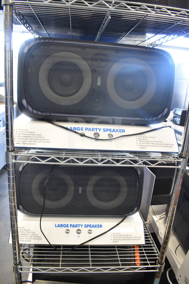 Two Onn Portable Bluetooth Speakers on shelves, featuring Bluetooth, 12-hour playtime, 640 watts power, LED effects, and IPX4 water resistance.