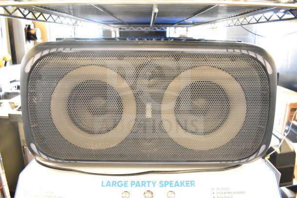 Onn Large Party Bluetooth Speaker with dual drivers, FM radio, IPX4 water resistance, and bass boost feature.