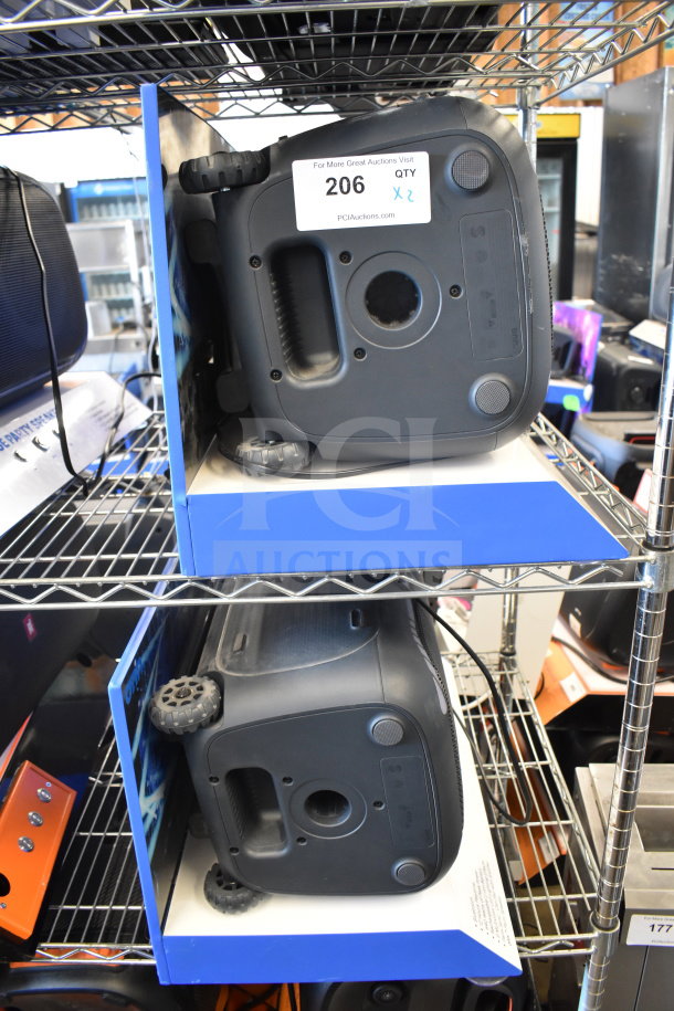 Two Onn portable Bluetooth speakers on a metal shelf, labeled "206" with qty "2".