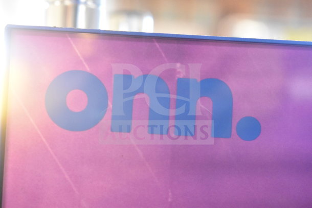 Two Onn portable Bluetooth speakers, new condition, purple exterior with blue logo branding.