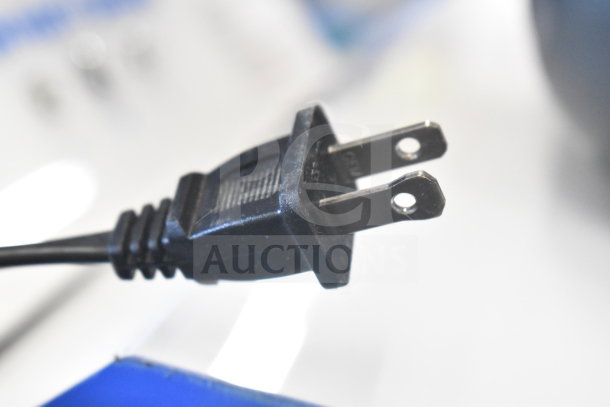 Black electrical plug with two prongs.