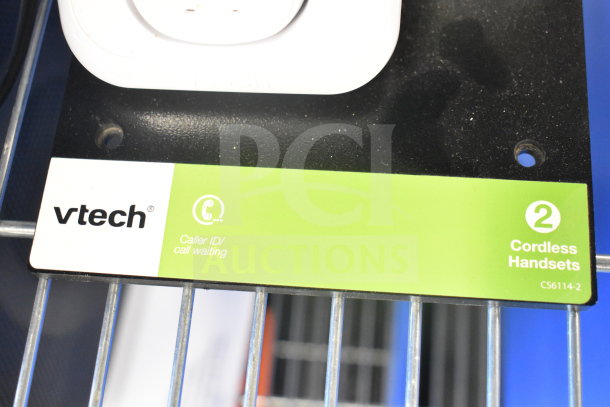 VTech cordless phone pack label, featuring caller ID and call waiting, model CS6114-2 on a store display.