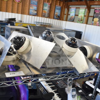 10 dome security cameras mounted on metal plates, in good condition. Includes auction tag number 210.