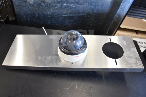 Bosch dome security camera on metal mounting panel, sleek design, good condition, offers 10 units per bid.