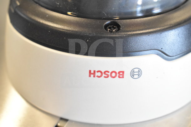 Bosch dome security camera, featuring a sleek design and sturdy build. Ideal for surveillance. Marked with Bosch logo.