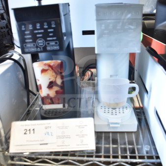 Chefman Single Cup Coffee Machine duo on shelf, digital display, black and white units, auction lot 211 tag visible.