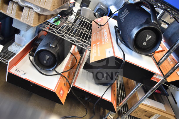 3 JBL Boombox 3 portable Bluetooth speakers in boxes, new condition, featuring powerful sound and waterproof design.