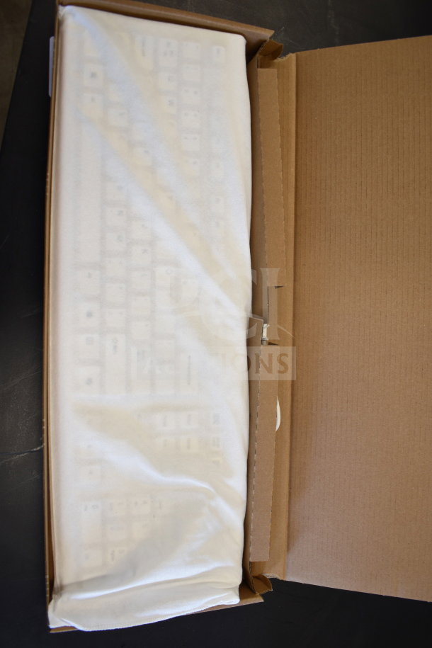Acer C24B Series keyboard in original packaging, wrapped in white fabric, indicating new or unused condition.