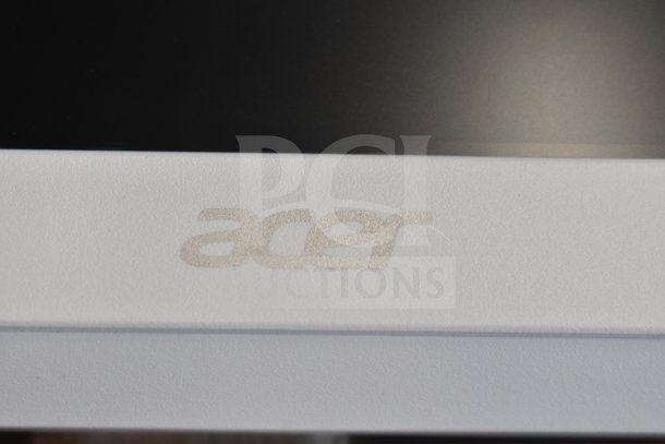 Close-up of the Acer logo on the C24B Series Personal Computer.