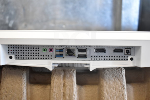 Acer C24B Series PC ports close-up, showing various input/output connections including USB and HDMI.