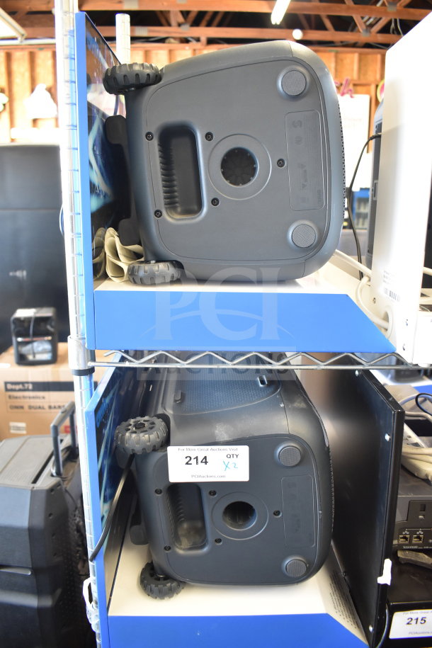 2 Onn large party speakers with wheels, black, in good condition. Tags indicate "214 QTY X2."