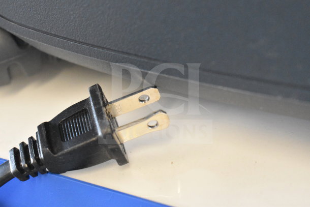 Close-up of a power plug for an Onn Large Party Speaker, highlighting its condition and connectivity feature.