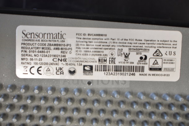 2 Sensormatic ZBAMB9010-IPS Deactivator Controllers; product code, regulatory model, and serial number visible.