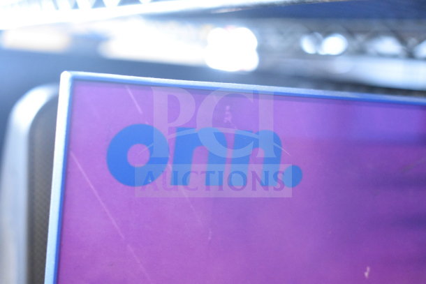 Onn medium party speaker showing label, purple and blue design. Part of auction: Samsung speaker and Onn speaker set.