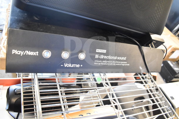 Samsung speaker with bi-directional sound and volume control buttons. Includes Onn medium party speaker.