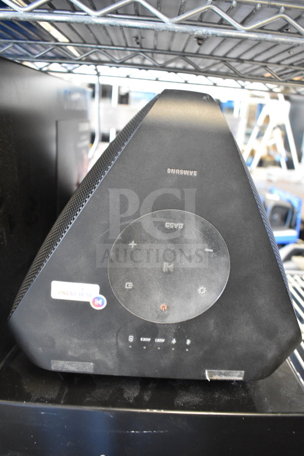 Samsung speaker with touch controls, visible minor wear. Includes Onn Medium Party Speaker. Two items for bid.