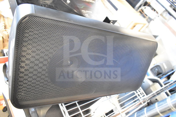 Samsung speaker with black mesh grille. Auction includes Onn medium party speaker. Both in used condition. Bid for both items.