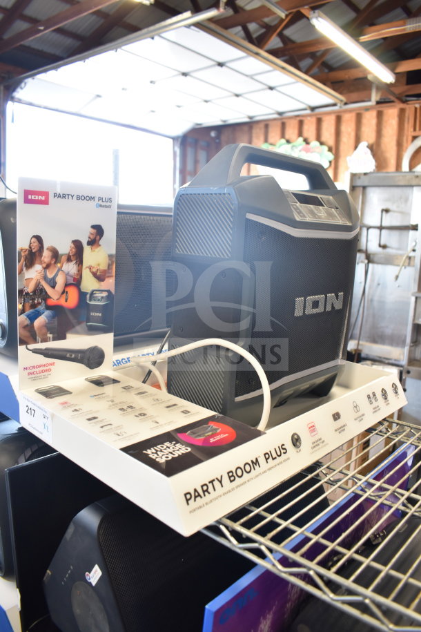 2 Ion Party Boom Plus speakers with Bluetooth, brand new in packaging. Features include wide-range sound, microphone included.