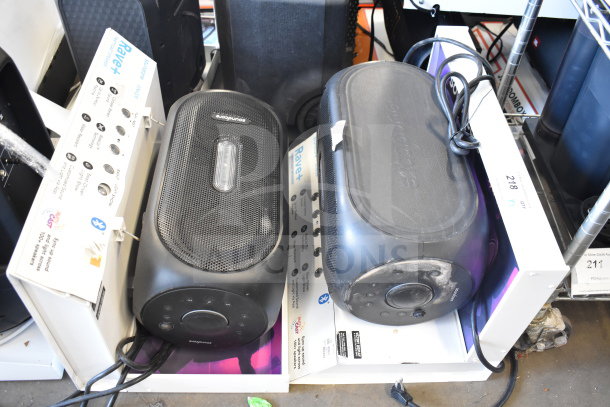 Two Anker Soundcore Rave+ Partycast Speakers, black, in boxes. Features buttons, dials, and prominent branding.