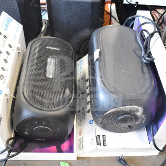 Two Anker Soundcore Rave+ Partycast Speakers, black, in boxes. Features buttons, dials, and prominent branding.
