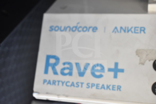 Two Anker Soundcore Rave+ Partycast speakers in original packaging. High-quality audio, ideal for parties. Brand label visible.