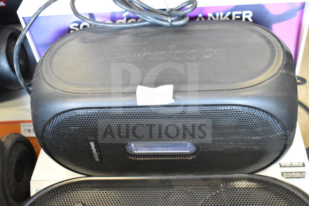 Pair of Anker Soundcore Rave+ Partycast Speakers, black, featuring robust sound, mesh grille design, and brand logo.