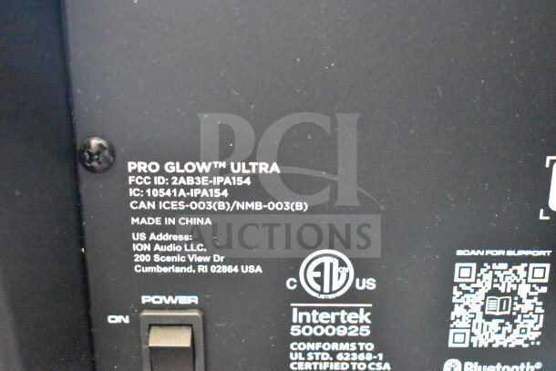 Close-up of Ion Pro Glow Ultra speaker label showing FCC ID, IC number, and certification marks. Made in China. Power switch visible.