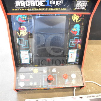 Arcade 1UP Pac-Man Machine, Model PAC-A-501030, features classic game art, joystick controls, in good condition.