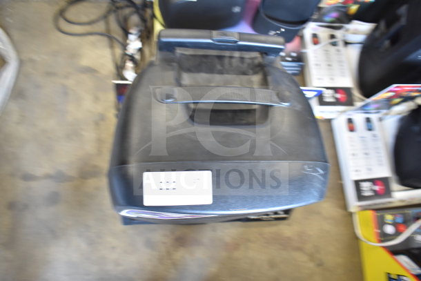 Altec Lansing IMT7002 Speaker, black, features carry handle, top view, visible label, used condition.