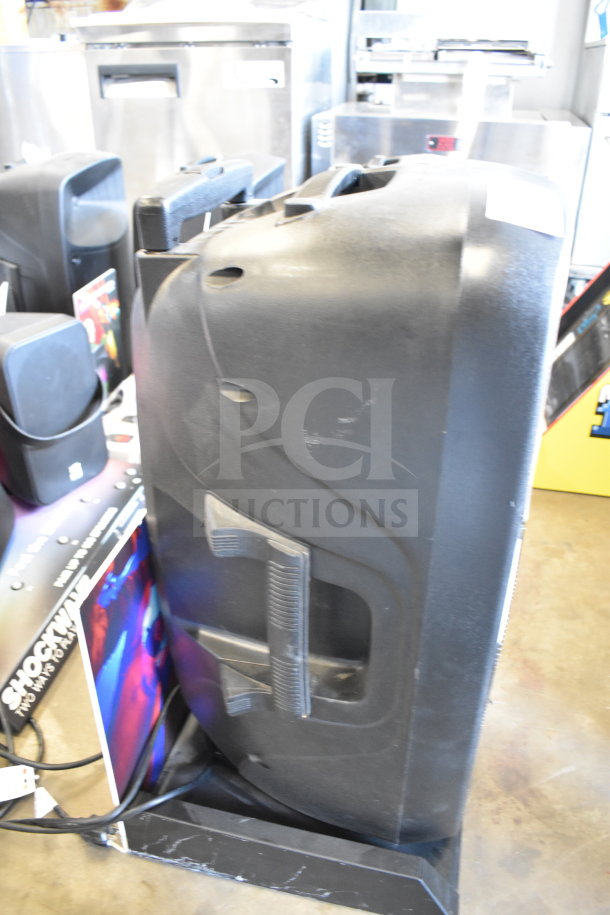 Altec Lansing IMT7002 speaker, black, used condition, side view showing handle and controls, visible scuffs.