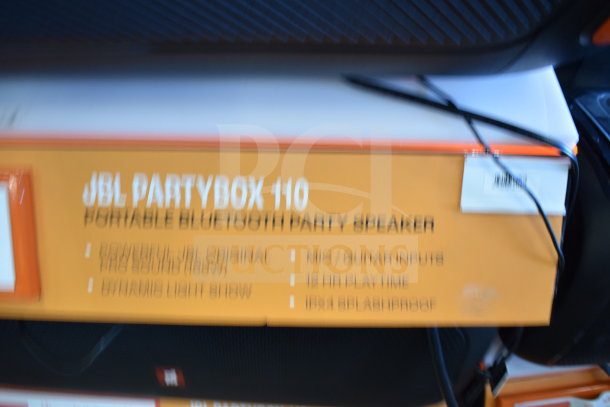 JBL PartyBox 110 portable Bluetooth speaker display. Features: Original Pro Sound, dynamic light show, mic/guitar inputs, 12hr playtime, IPX4 splashproof.