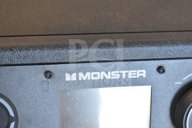 Monster MNRRX Rockin' Roller Speaker top section, showing textured black finish and white Monster logo.