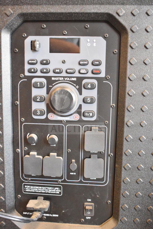 Monster MNRRX Rockin' Roller Speaker control panel with knobs, buttons, and input ports. Features master volume dial and recording options.