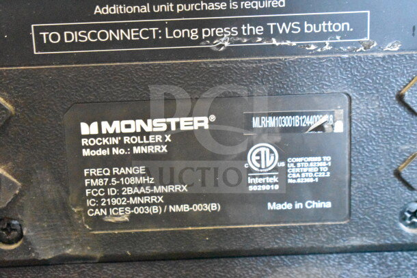 Monster MNRRX Rockin' Roller Speaker label. Shows model, frequency range, and certification marks. Made in China.